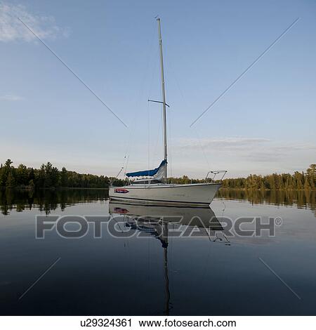 Sailboat anchored at Lake of the Woods, Ontario View Large Photo Image Stock Image - Sailboat anchored at Lake of the Woods, Ontario. Fotosearch