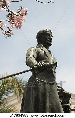 Sculpture of a man from the 19th century wearing a frock coat and carrying a walking stick View Large Photo Image Stock Image - Sculpture of a man from the 19th century wearing a frock coat and carrying a walking stick. Fotosearch