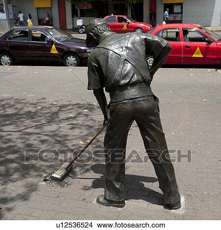 Sculpture of a man sweeping the street in San Jose Costa Rica View Large Photo Image Picture - Sculpture of a man sweeping the street in San Jose Costa Rica. Fotosearch