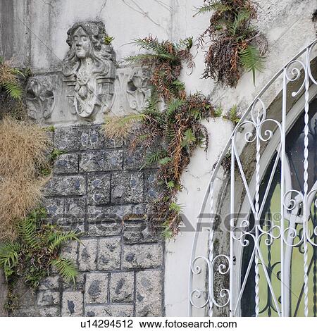 Stock Image - Sculptures on exterior walls in San Jose. Fotosearch