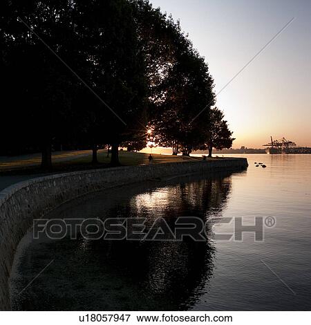 Stock Photo - Sea wall at dusk in Vancouver, British Columbia, Canada. Fotosearch