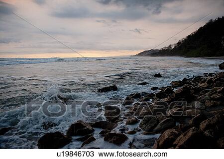 Stock Image - Seascape along Mal Pais coastline in San Jose Costa Rica. Fotosearch