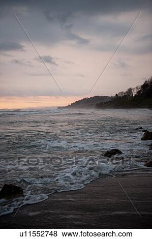 Stock Photo - Seascape along Mal Pais coastline in San Jose Costa Rica. Fotosearch