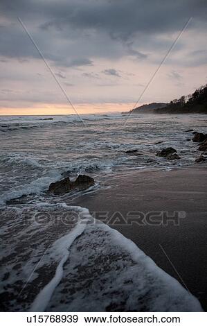 Stock Photo - Seascape along Mal Pais coastline in San Jose Costa Rica. Fotosearch