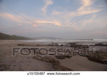 Stock Photo - Seascape with afterglow in San Jose Costa Rica. Fotosearch