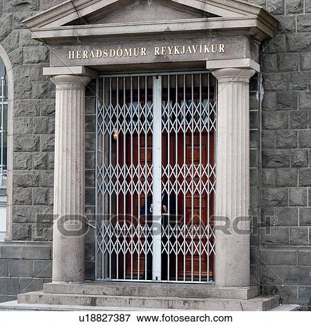 Stock Photo - Security gates in front of main formal doors, with marble columns and pediment. Fotosearch