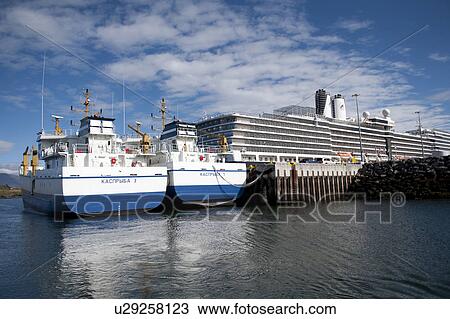 Stock Image - Ships docked at wharf. Fotosearch