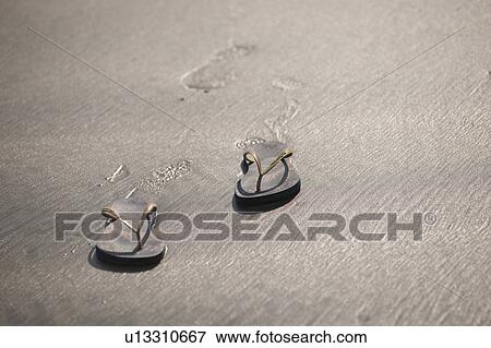 Stock Photo - Shoes on sand. Fotosearch