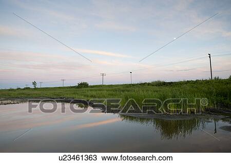 Stock Image - Shoreline along waterway at Lake of the Woods, Ontario. Fotosearch