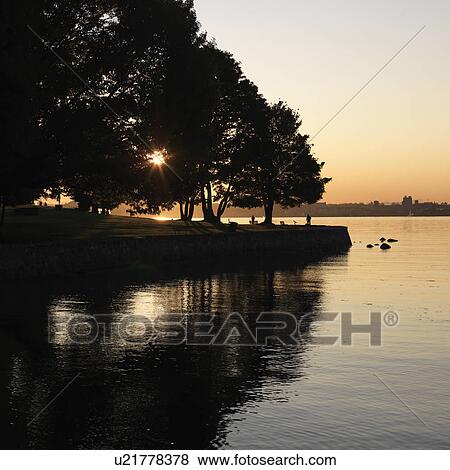 Stock Photo - Shoreline at dusk in Vancouver, British Columbia, Canada. Fotosearch