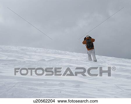 Picture - Skier on a mountain slope in Vail, Colorado . Fotosearch