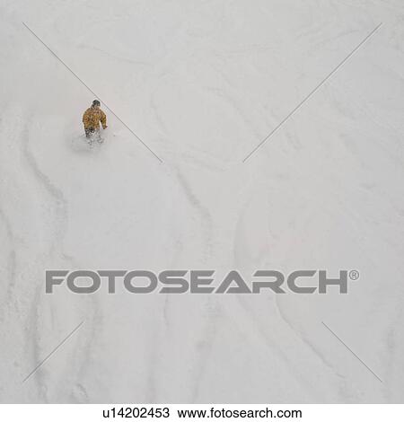 Stock Image - Skier on a ski slope in Vail, Colorado. Fotosearch