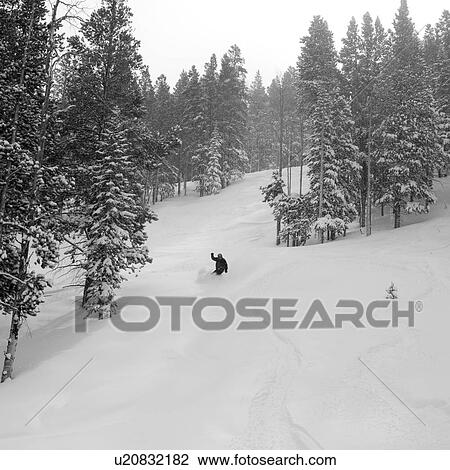 Stock Image - Skier on a ski slope in Vail, Colorado. Fotosearch