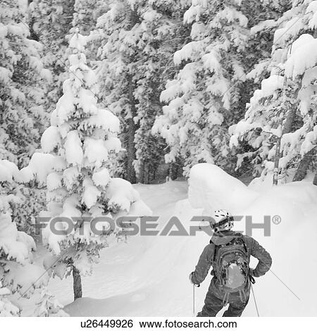 Stock Photograph - Skier on a ski slope in Vail, Colorado. Fotosearch
