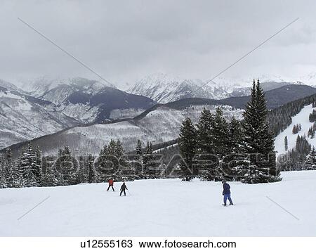 Skiers on a ski slope in Vail, Colorado View Large Photo Image Stock Image - Skiers on a ski slope in Vail, Colorado. Fotosearch