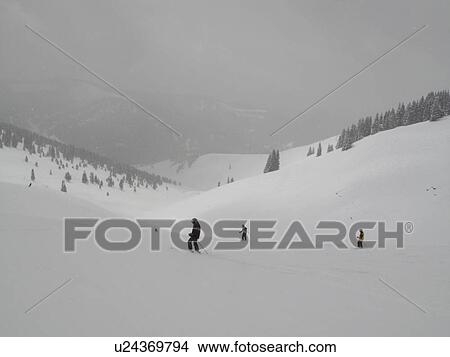 Picture - Skiing on a winter slope in Vail, Colorado. Fotosearch