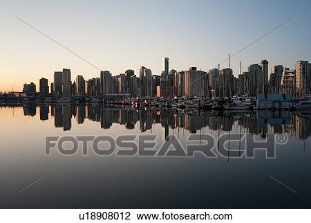 Stock Image - Skyline at dusk in Vancouver, British Columbia, Canada. Fotosearch