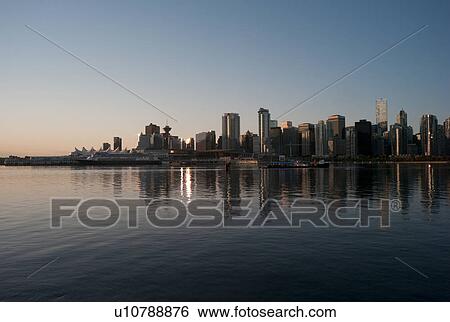 Stock Photograph - Skyline at dusk in Vancouver, British Columbia, Canada. Fotosearch