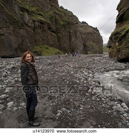 Smiling woman in canyon on rocky riverbed and stream View Large Photo Image Stock Image - Smiling woman in canyon on rocky riverbed and stream. Fotosearch