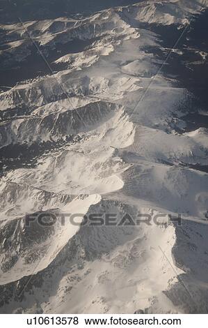 Snow on mountain peaks in Vail, Colorado View Large Photo Image Stock Photo - Snow on mountain peaks in Vail, Colorado. Fotosearch