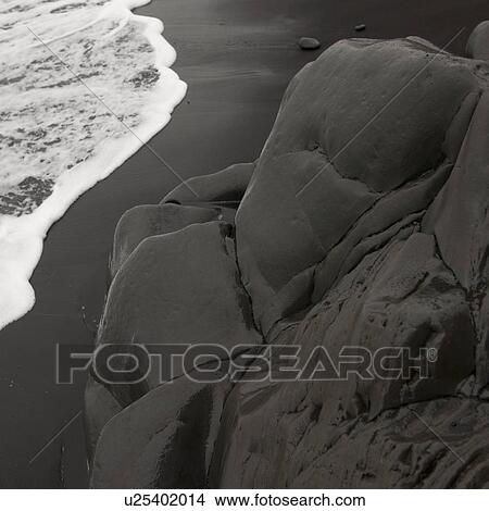 Picture - Soft round rock on cliff at beach. Fotosearch