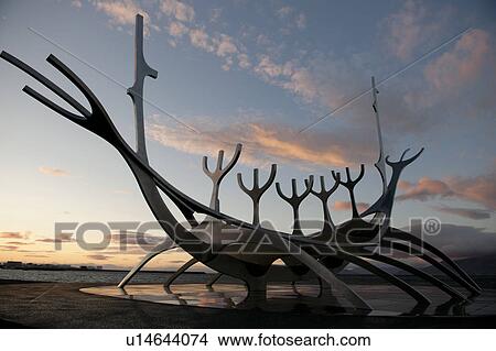 Solar Voyager sculpture - modern longboat at oceanside at sunset View Large Photo Image Picture - Solar Voyager sculpture - modern longboat at oceanside at sunset. Fotosearch