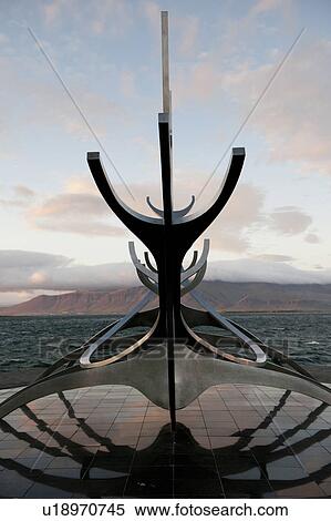 Stock Photography - Solar Voyager sculpture overlooking ocean in Iceland. Fotosearch