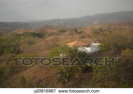 Solitary white house with an orange roof in the hilltops of Costa Rica View Large Photo Image Stock Photo - Solitary white house with an orange roof in the hilltops of Costa Rica. Fotosearch