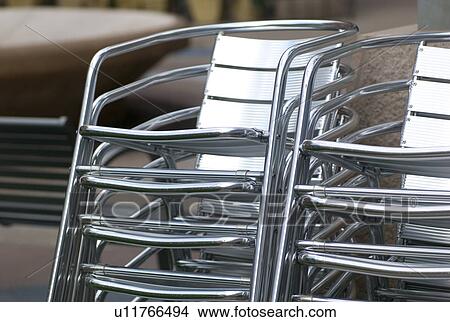 Stack of metal chairs in Rochester, Minnesota, USA View Large Photo Image Picture - Stack of metal chairs in Rochester, Minnesota, USA. Fotosearch