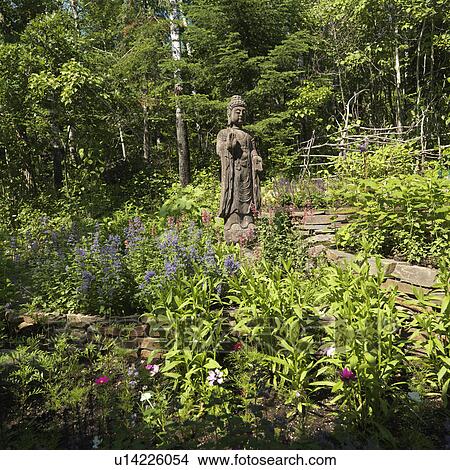 Statue in a garden at Lake of the Woods, Ontario View Large Photo Image Picture - Statue in a garden at Lake of the Woods, Ontario. Fotosearch
