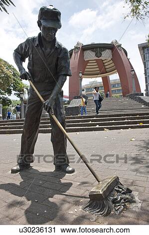 Statue of workman sweeping the street in San Jose Costa Rica View Large Photo Image Stock Image - Statue of workman sweeping the street in San Jose Costa Rica. Fotosearch