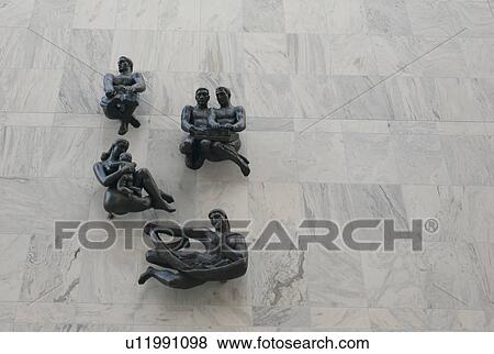 Stock Photo - Statues on a wall of the Mayo Clinic in Rochester, Mennisota, USA. Fotosearch