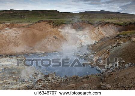 Steam rising from rocky geothermal pool View Large Photo Image Stock Photo - Steam rising from rocky geothermal pool. Fotosearch