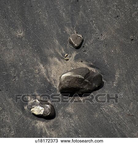 Stock Image - Stones along the seashore in Costa Rica. Fotosearch