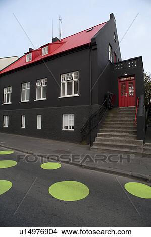 Picture - Street with green dots on the pavement in Iceland. Fotosearch