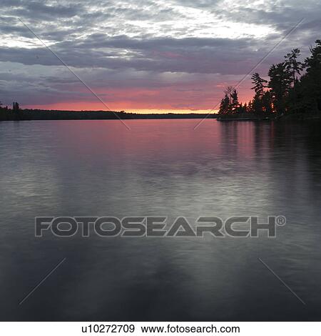 Sunset at Lake of the Woods, Ontario View Large Photo Image Stock Photo - Sunset at Lake of the Woods, Ontario. Fotosearch