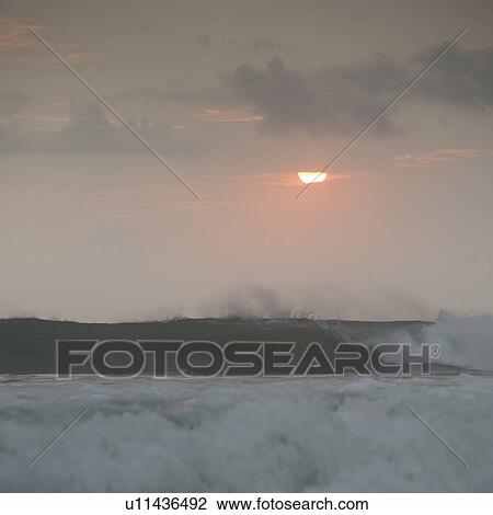 Stock Image - Sunset over Coast Rica seascape. Fotosearch