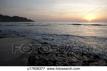 Stock Photo - Sunset over the beach at Costa Rica with cool overtones. Fotosearch