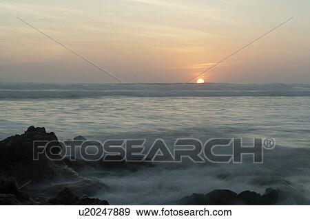 Stock Photo - Sunset seascape in San Jose Costa Rica. Fotosearch