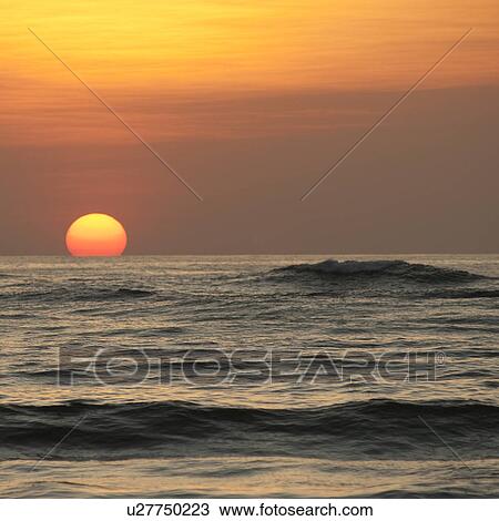 Stock Image - Sunset sky over Costa Rica. Fotosearch