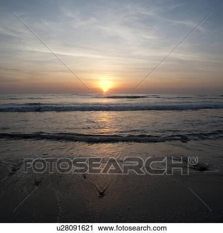 Stock Image - Sunset sky over Costa Rica. Fotosearch