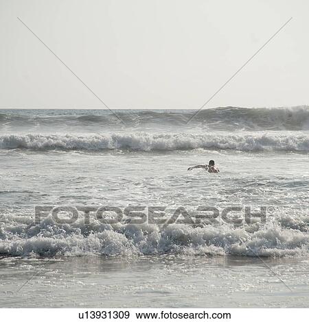 Swimmer in the ocean off coast of Costa Rica View Large Photo Image Stock Photo - Swimmer in the ocean off coast of Costa Rica. Fotosearch