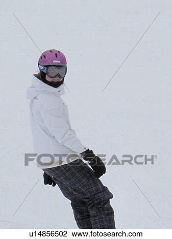 Teenage girl snowboarding on a ski slope in Vail, Colorado View Large Photo Image Stock Image - Teenage girl snowboarding on a ski slope in Vail, Colorado . Fotosearch