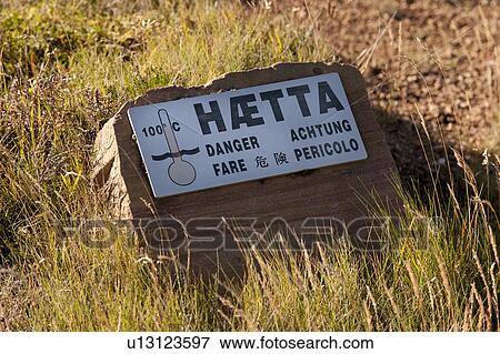 Temperature warning sign surrounded by grass View Large Photo Image Stock Photo - Temperature warning sign surrounded by grass. Fotosearch