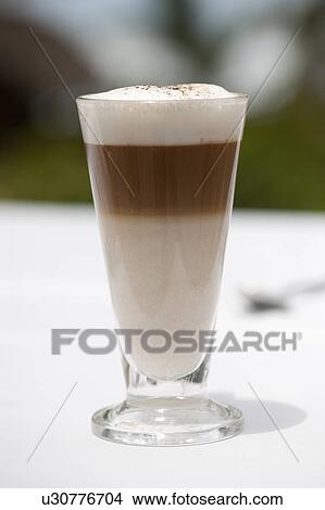 Three layer frothy coffee in a glass mug View Large Photo Image Picture - Three layer frothy coffee in a glass mug. Fotosearch