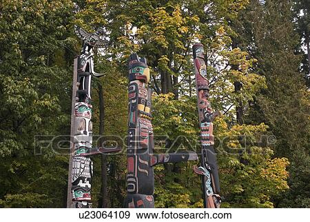 Stock Photo - Totem Poles in Stanley Park in Vancouver, British Columbia, Canada. Fotosearch
