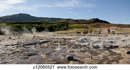 Tourists at steaming geysers, gnome in foreground View Large Photo Image Stock Photo - Tourists at steaming geysers, gnome in foreground. Fotosearch