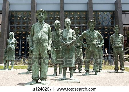 Verdigris bronze statues of agricultural workers standing in a crowd View Large Photo Image Stock Image - Verdigris bronze statues of agricultural workers standing in a crowd. Fotosearch