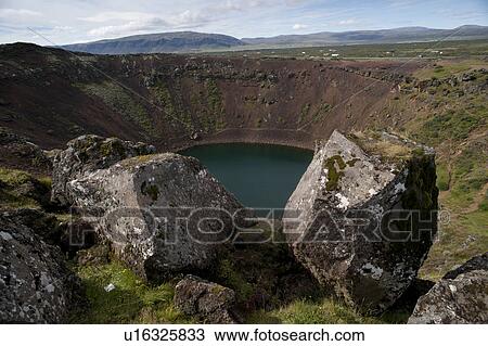 Volcanic crater lake with moss and lichen covered boulders View Large Photo Image Stock Image - Volcanic crater lake with moss and lichen covered boulders . Fotosearch