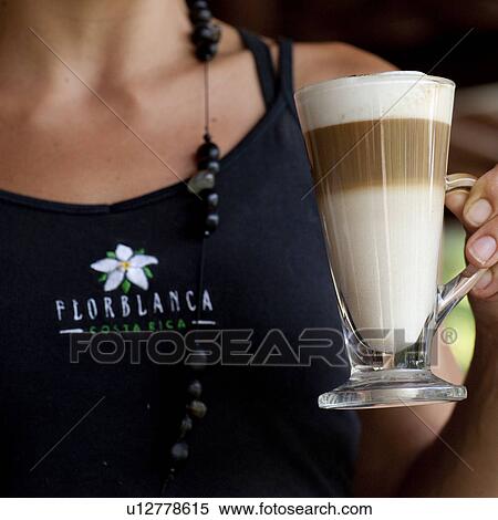 Waitress holding a beverage cup at Florblanca in Costa Rica View Large Photo Image Stock Photography - Waitress holding a beverage cup at Florblanca in Costa Rica. Fotosearch